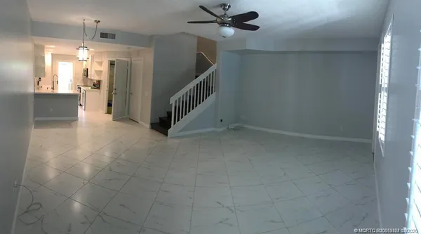 a view of a hallway view with staircase