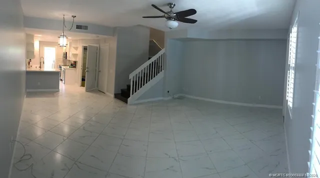 a view of a hallway view with staircase