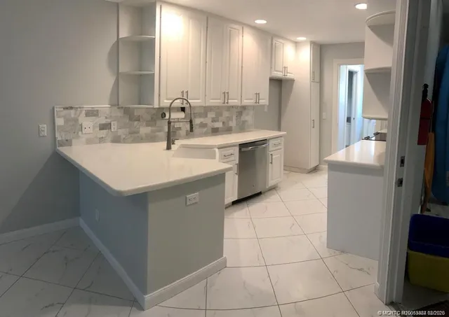 a bathroom with a sink a mirror and a shower