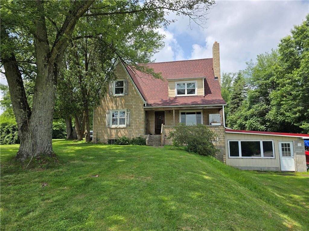 368 Pittsburgh Road Butler, PA 16002 - Photo 2 of 26 a front view of a house with a garden
