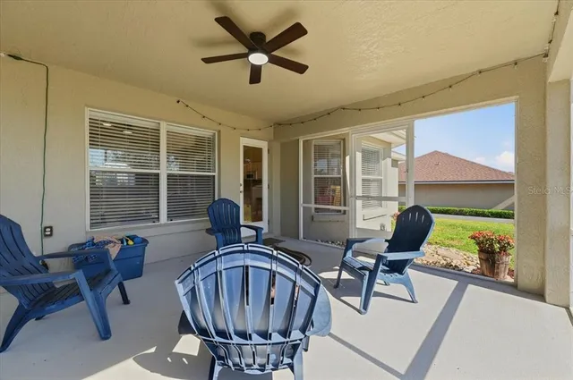 a view of a livingroom with furniture and a porch