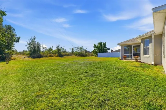 a view of a house with a big yard