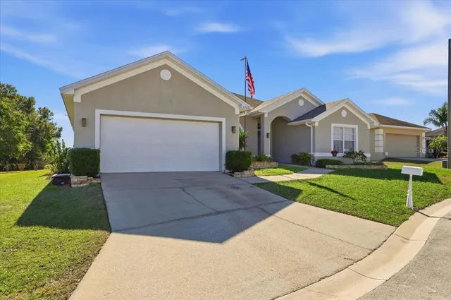 a front view of a house with yard