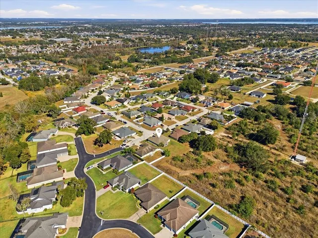 an aerial view of residential building with parking space