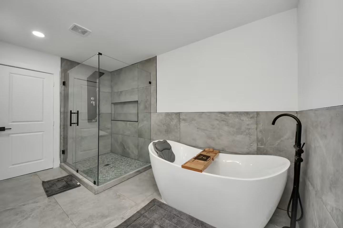 6747 Peerless Street Houston, TX 77021 - Photo 12 of 33 a white bath tub sitting next to a shower