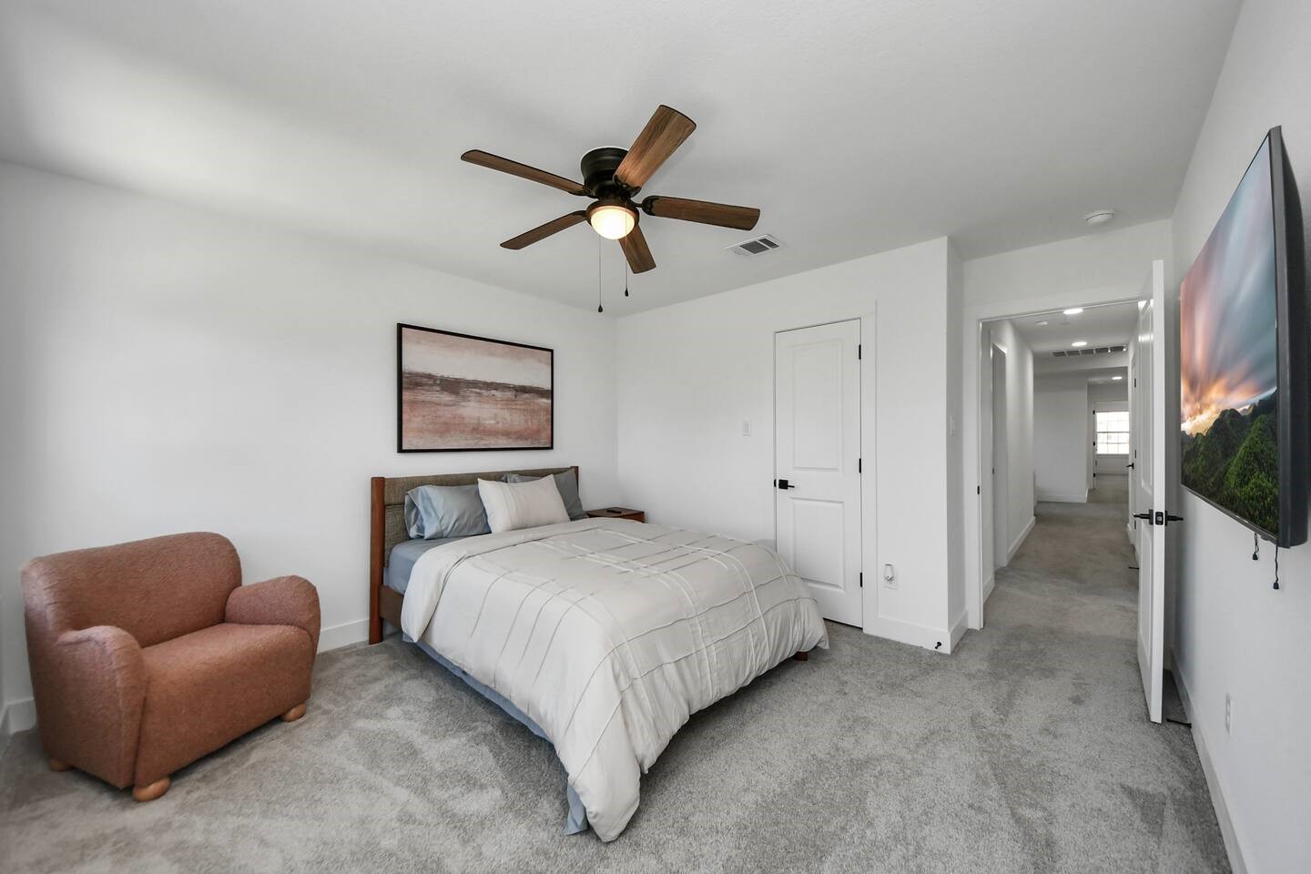 6747 Peerless Street Houston, TX 77021 - Photo 17 of 33 a spacious bedroom with a bed and a chandelier