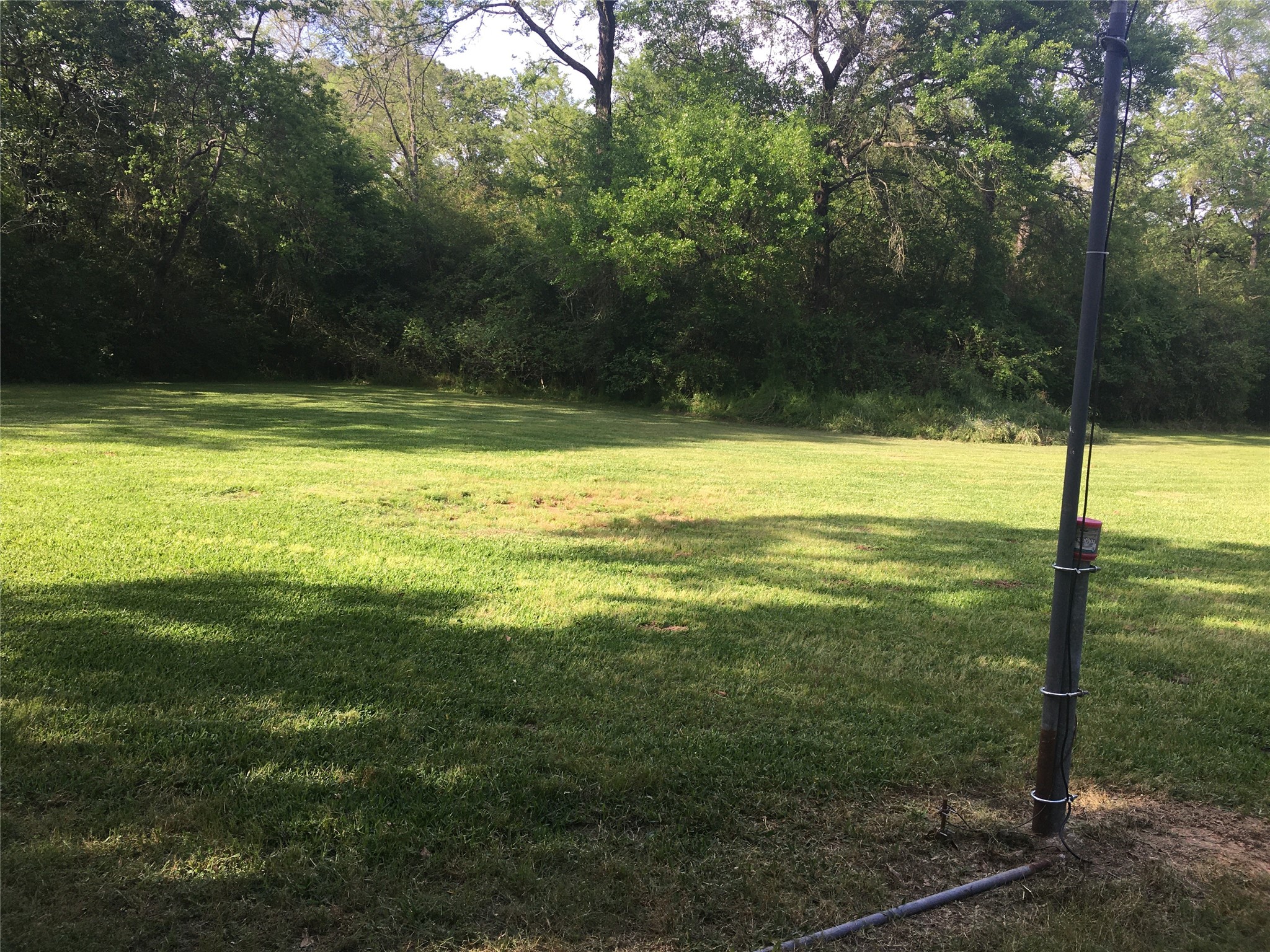 2160 Bowler Road Waller, TX 77484 - Photo 2 of 24 a view of a swimming pool with an outdoor space and seating area