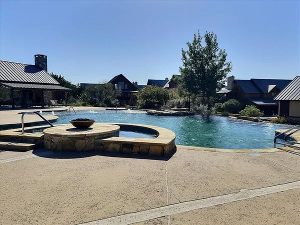 a view of a swimming pool with an outdoor seating