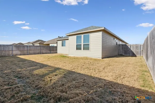 a view of backyard of house