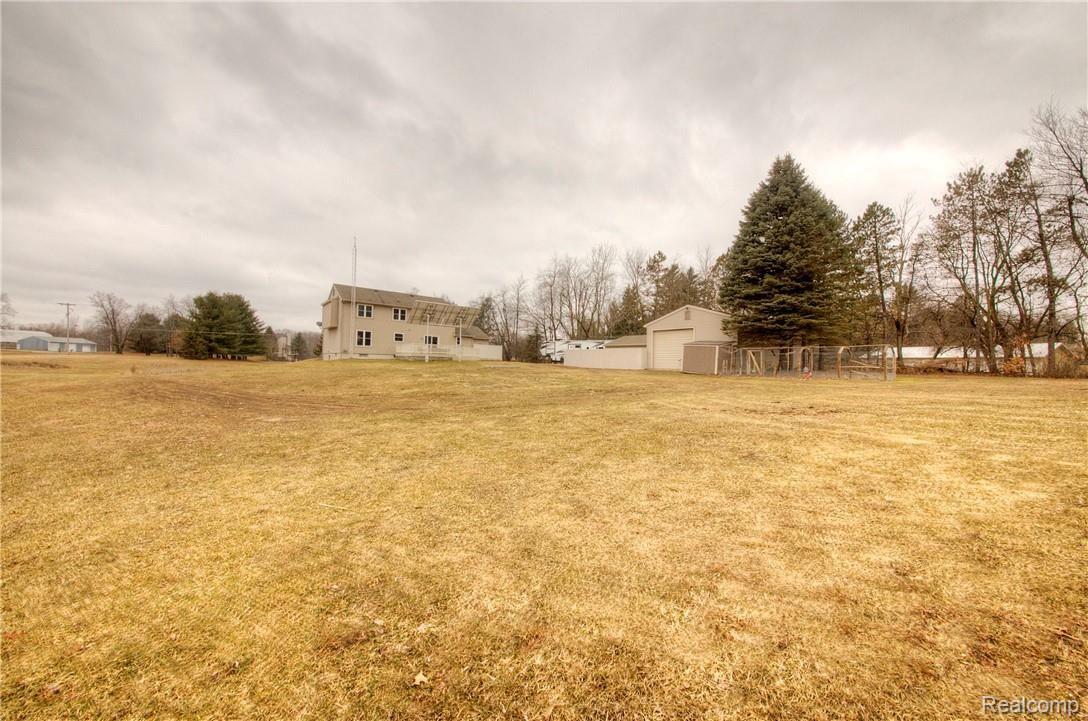 9213 Coleman Road Haslett, MI 48840 - Photo 62 of 99 Ground Level View of Home from Rear