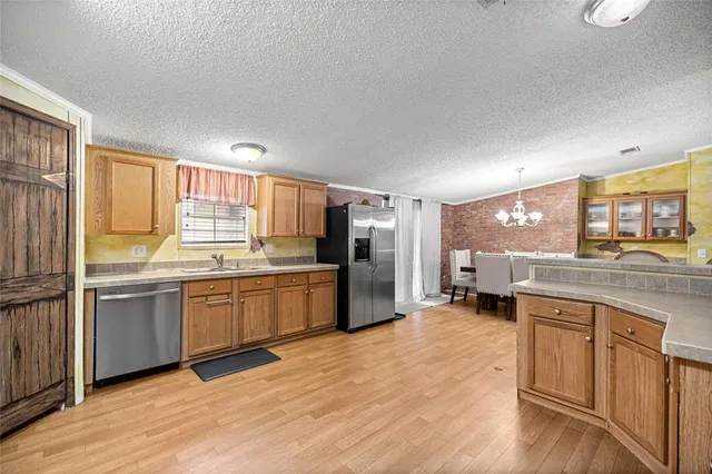a kitchen with a sink cabinets and counter top space