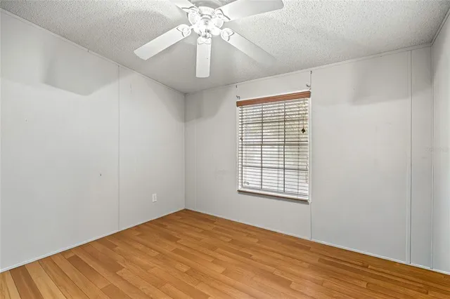 a view of a workspace with furniture and wooden floor