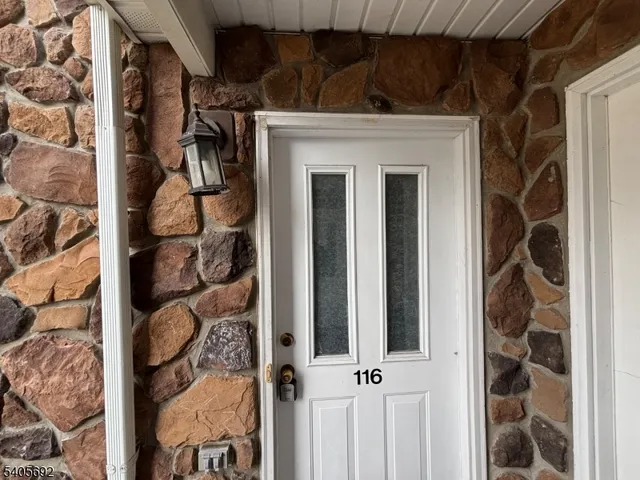 a view of a door and a window