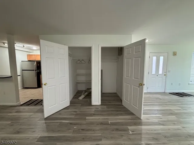 a view of entryway with wooden floor