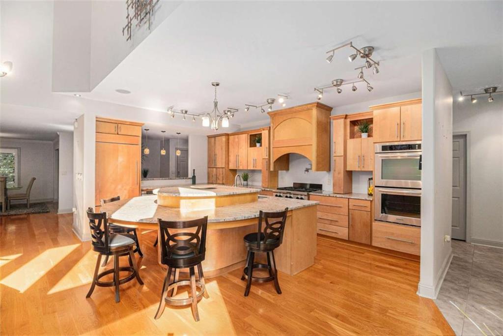 2994 East Ramble Lane Decatur, GA 30033 - Photo 13 of 111 a large kitchen with a table and chairs in it