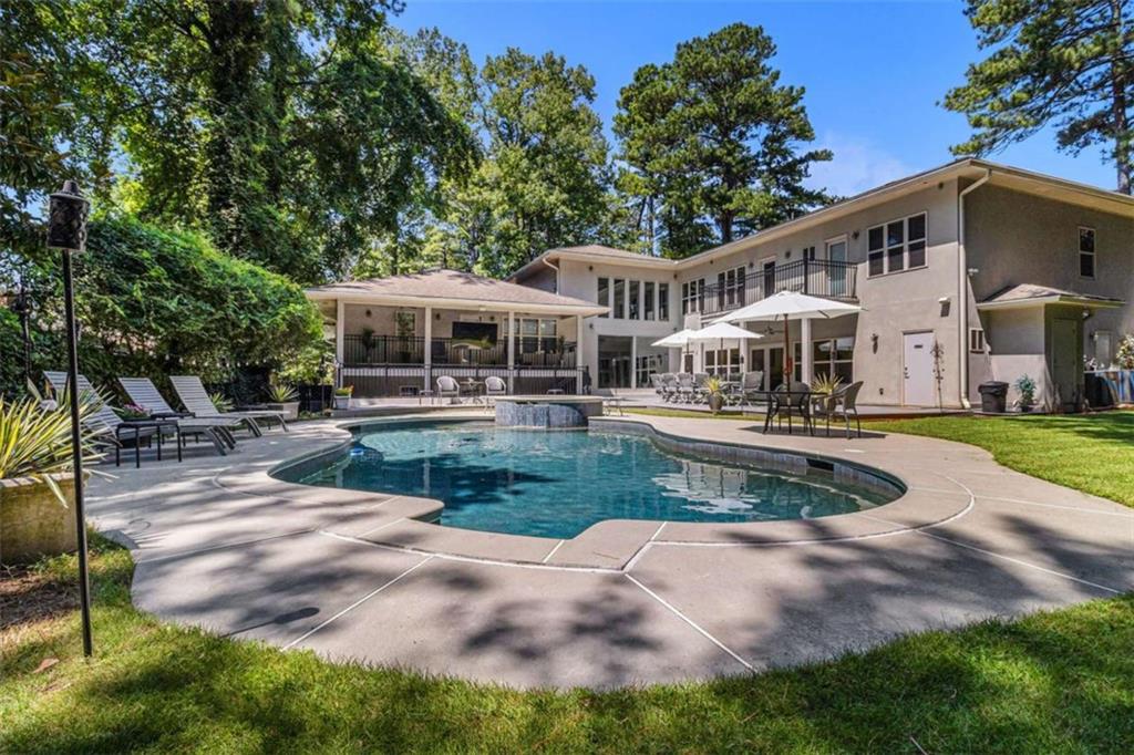 2994 East Ramble Lane Decatur, GA 30033 - Photo 2 of 111 a front view of a house with a yard table and chairs