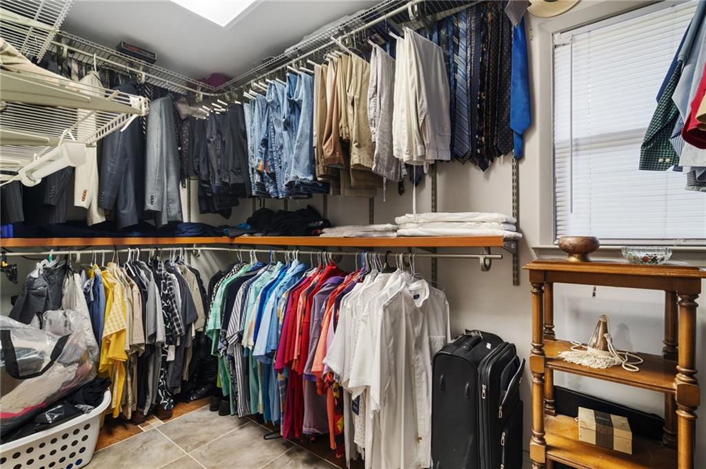 2994 East Ramble Lane Decatur, GA 30033 - Photo 28 of 111 a view of walk in closet with clothes and shoes