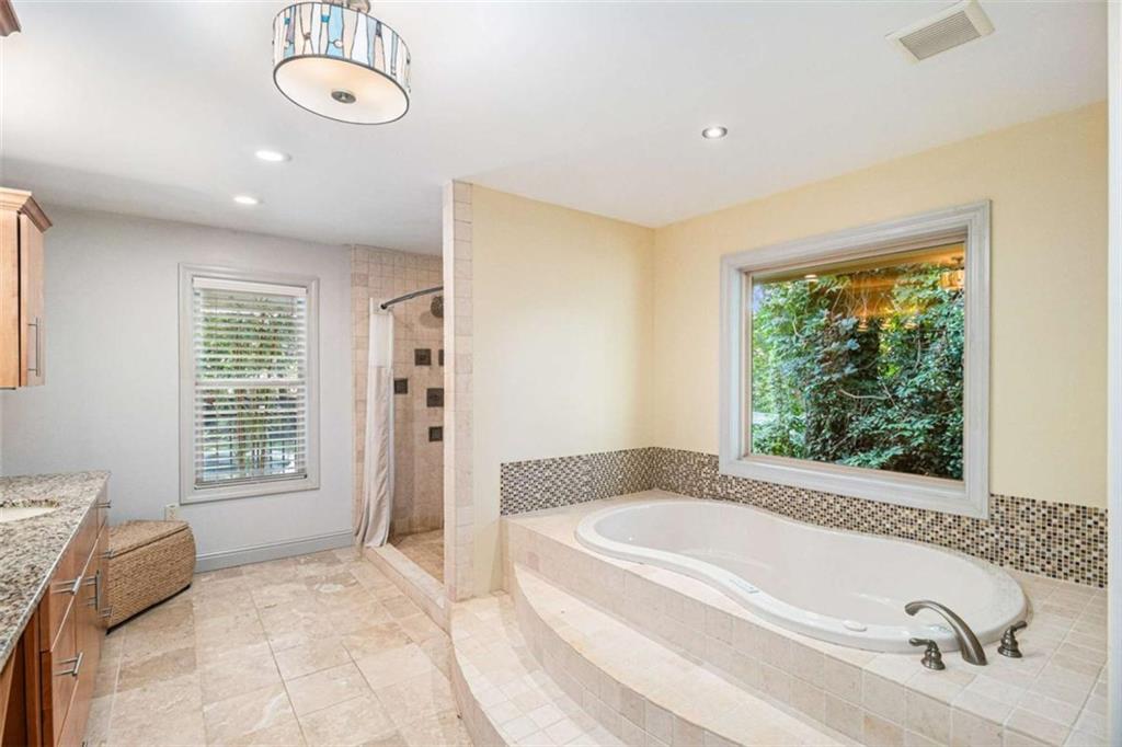 2994 East Ramble Lane Decatur, GA 30033 - Photo 32 of 111 a spacious bathroom with a tub sink and shower
