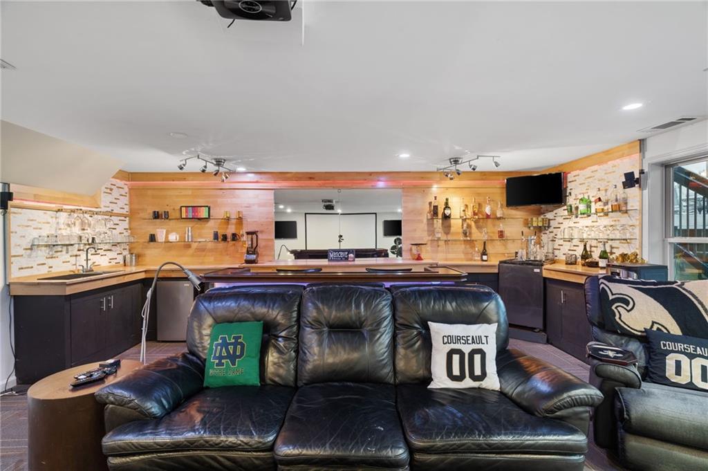 2994 East Ramble Lane Decatur, GA 30033 - Photo 48 of 111 a living room with furniture a flat screen tv and a window
