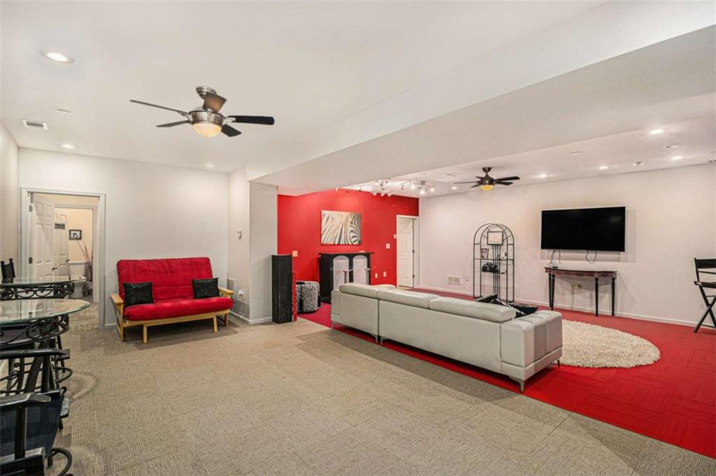 2994 East Ramble Lane Decatur, GA 30033 - Photo 57 of 111 a living room with furniture and a flat screen tv