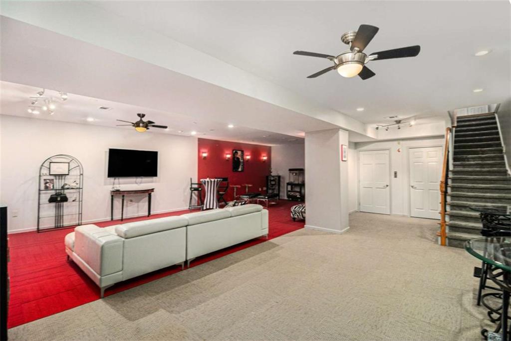 2994 East Ramble Lane Decatur, GA 30033 - Photo 58 of 111 a living room with furniture and a flat screen tv