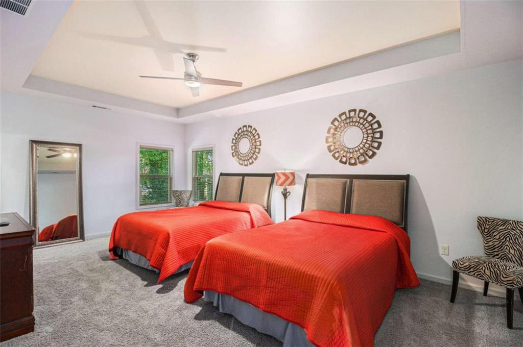 2994 East Ramble Lane Decatur, GA 30033 - Photo 72 of 111 a bedroom with two beds and a chandelier