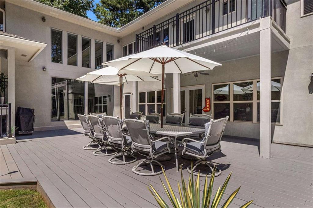 2994 East Ramble Lane Decatur, GA 30033 - Photo 81 of 111 a view of a patio with table and chairs under an umbrella
