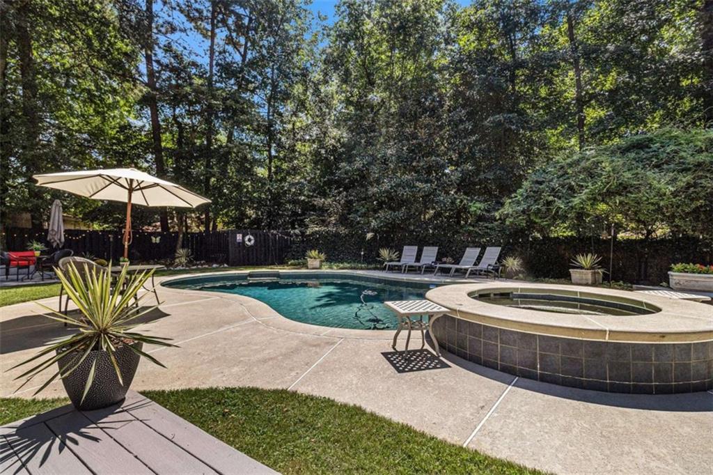 2994 East Ramble Lane Decatur, GA 30033 - Photo 84 of 111 a view of a backyard with table and chairs under an umbrella