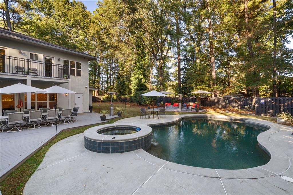 2994 East Ramble Lane Decatur, GA 30033 - Photo 85 of 111 a view of swimming pool with outdoor seating and a garden