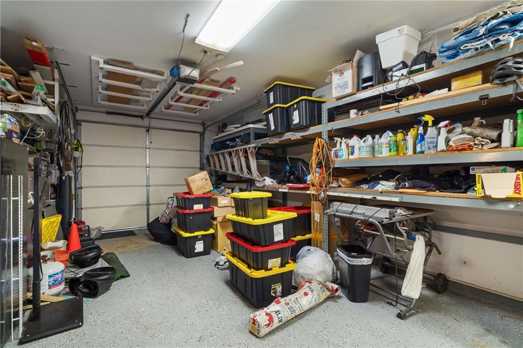 2994 East Ramble Lane Decatur, GA 30033 - Photo 93 of 111 a storage room with lots of clutter and cabinets