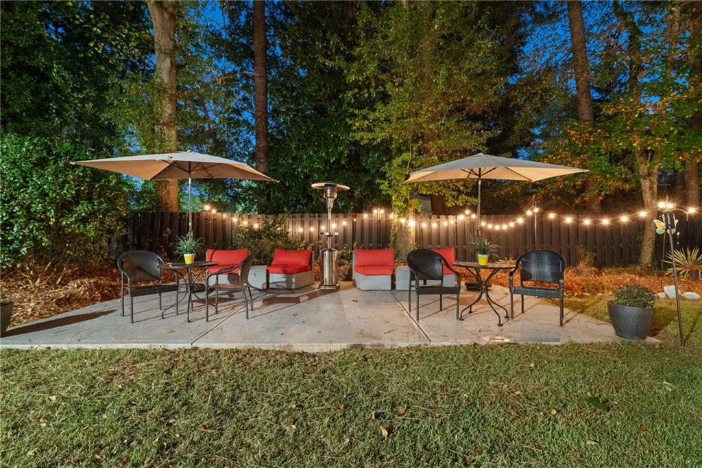 2994 East Ramble Lane Decatur, GA 30033 - Photo 97 of 111 city view of a patio with a table and chairs under an umbrella
