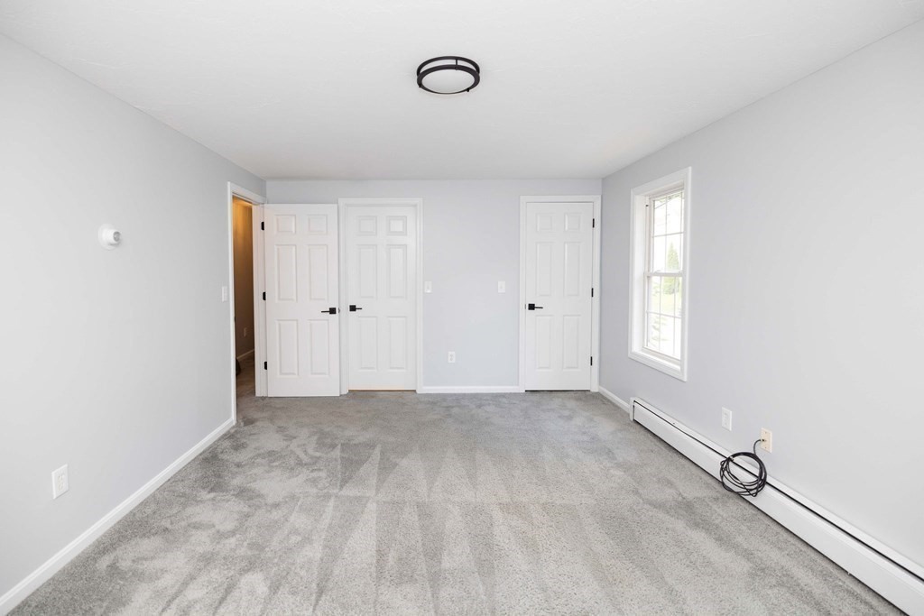 32 Rodney Street Worcester, MA 01605 - Photo 17 of 37 a view of an empty room with window and closet area