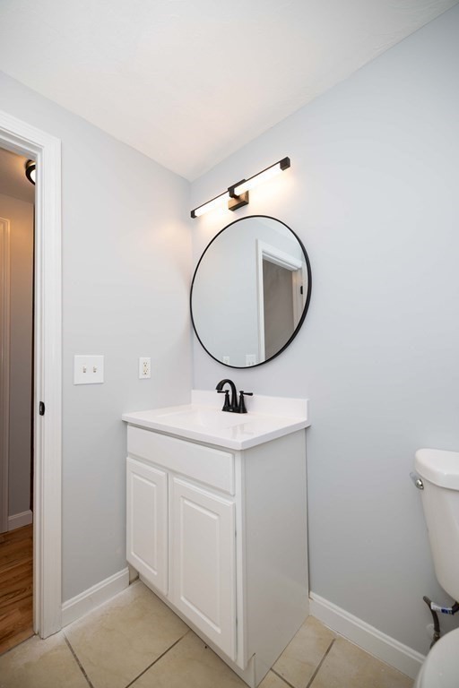 32 Rodney Street Worcester, MA 01605 - Photo 23 of 37 a bathroom with a sink and a mirror