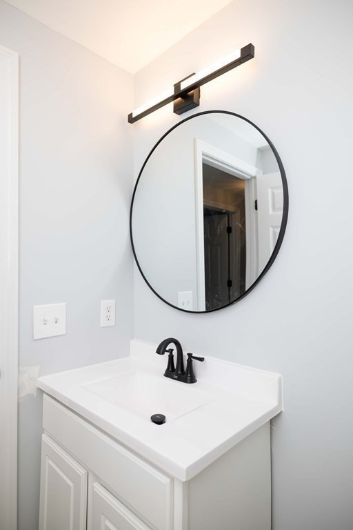 32 Rodney Street Worcester, MA 01605 - Photo 24 of 37 a bathroom with a sink and a mirror