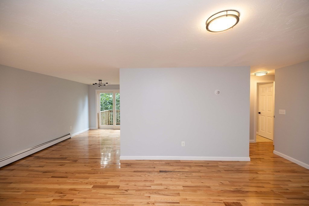 32 Rodney Street Worcester, MA 01605 - Photo 3 of 37 a view of room with window and wooden floor
