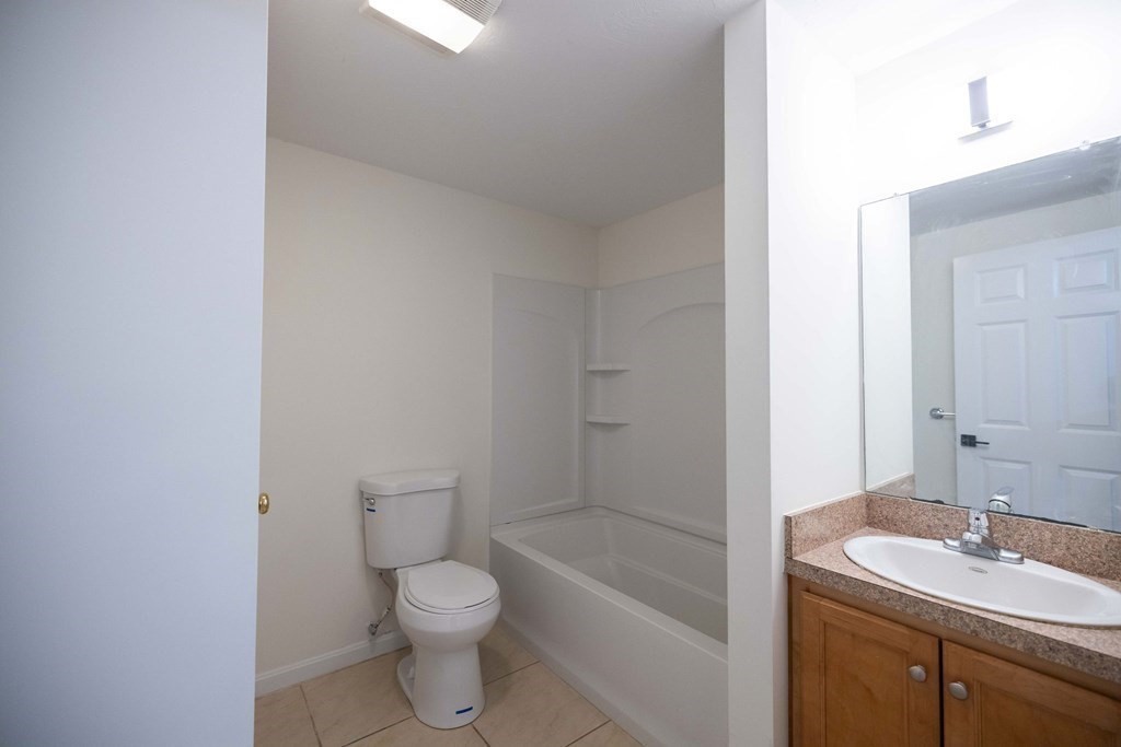 32 Rodney Street Worcester, MA 01605 - Photo 32 of 37 a bathroom with a sink a toilet and shower