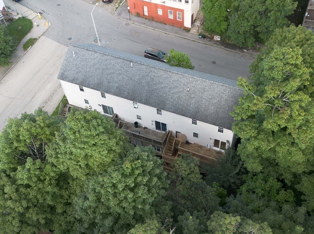 32 Rodney Street Worcester, MA 01605 - Photo 35 of 37 an aerial view of a house with a yard and garden