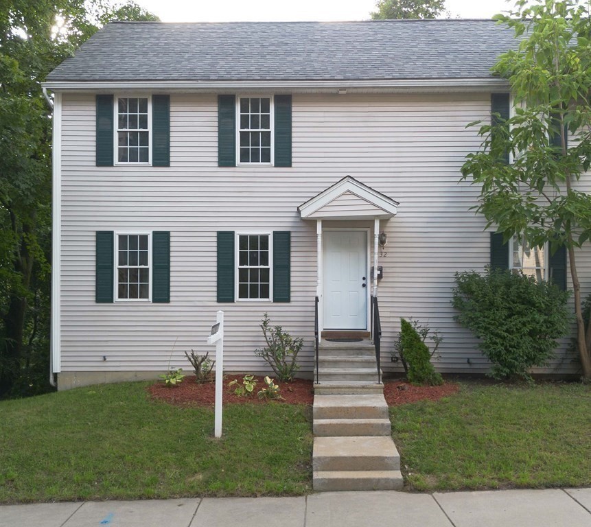 32 Rodney Street Worcester, MA 01605 - Photo 36 of 37 a front view of a house with a yard