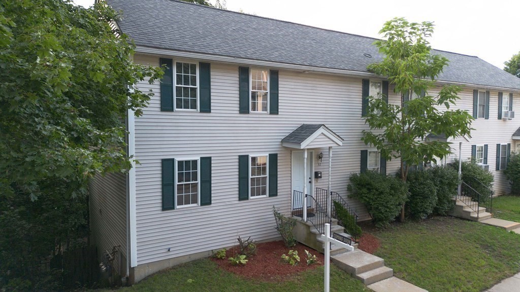 32 Rodney Street Worcester, MA 01605 - Photo 37 of 37 a view of house with a yard and potted plants