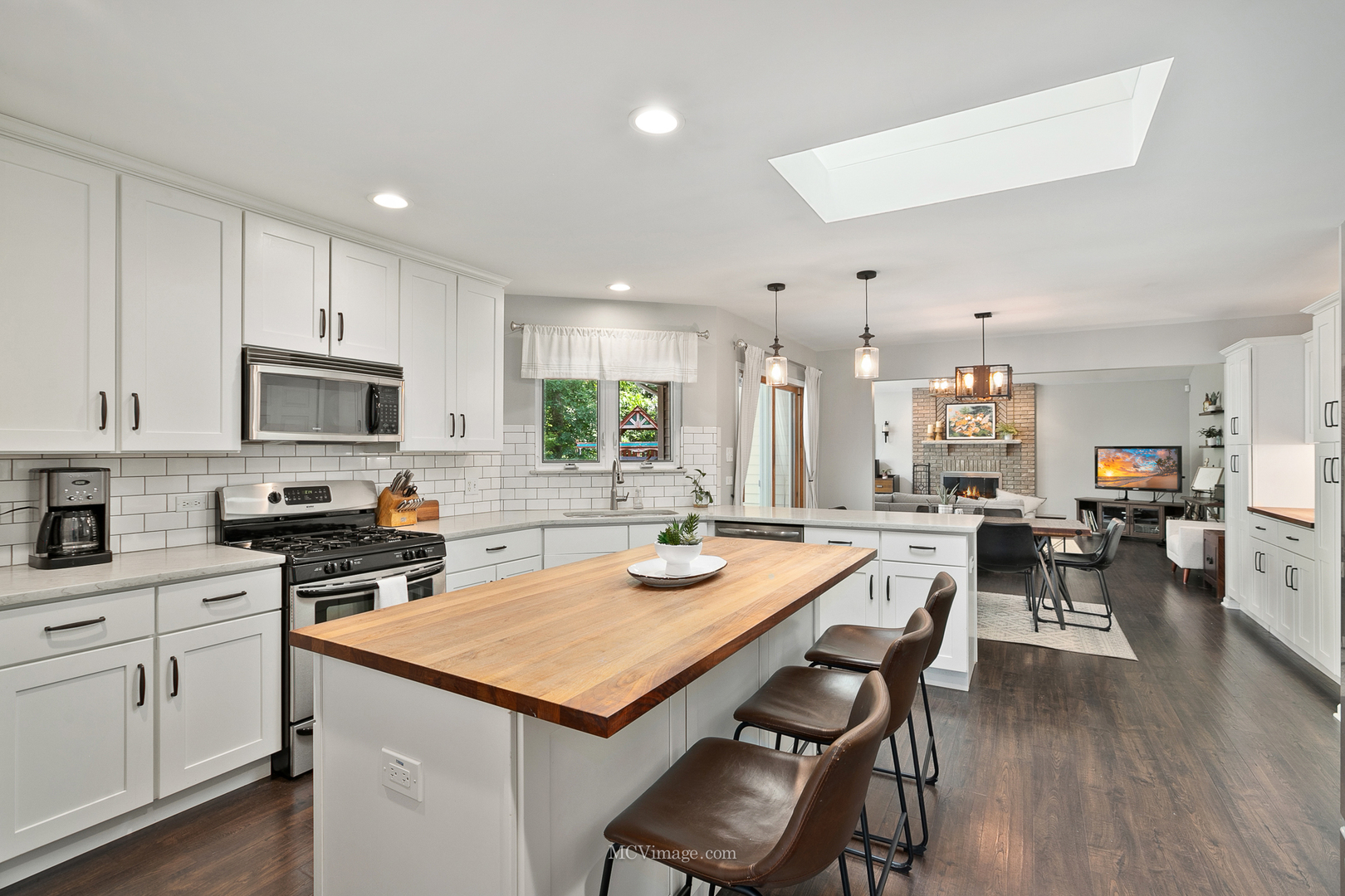 40 Zurich Court Crete, IL 60417 - Photo 12 of 40 a kitchen with a dining table chairs wooden floor appliances and cabinets