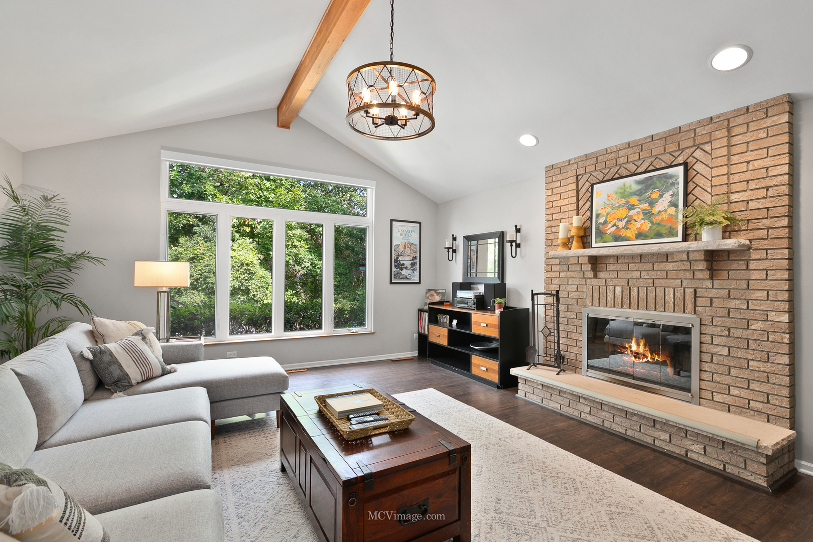 40 Zurich Court Crete, IL 60417 - Photo 14 of 40 a living room with furniture a fireplace and a large window