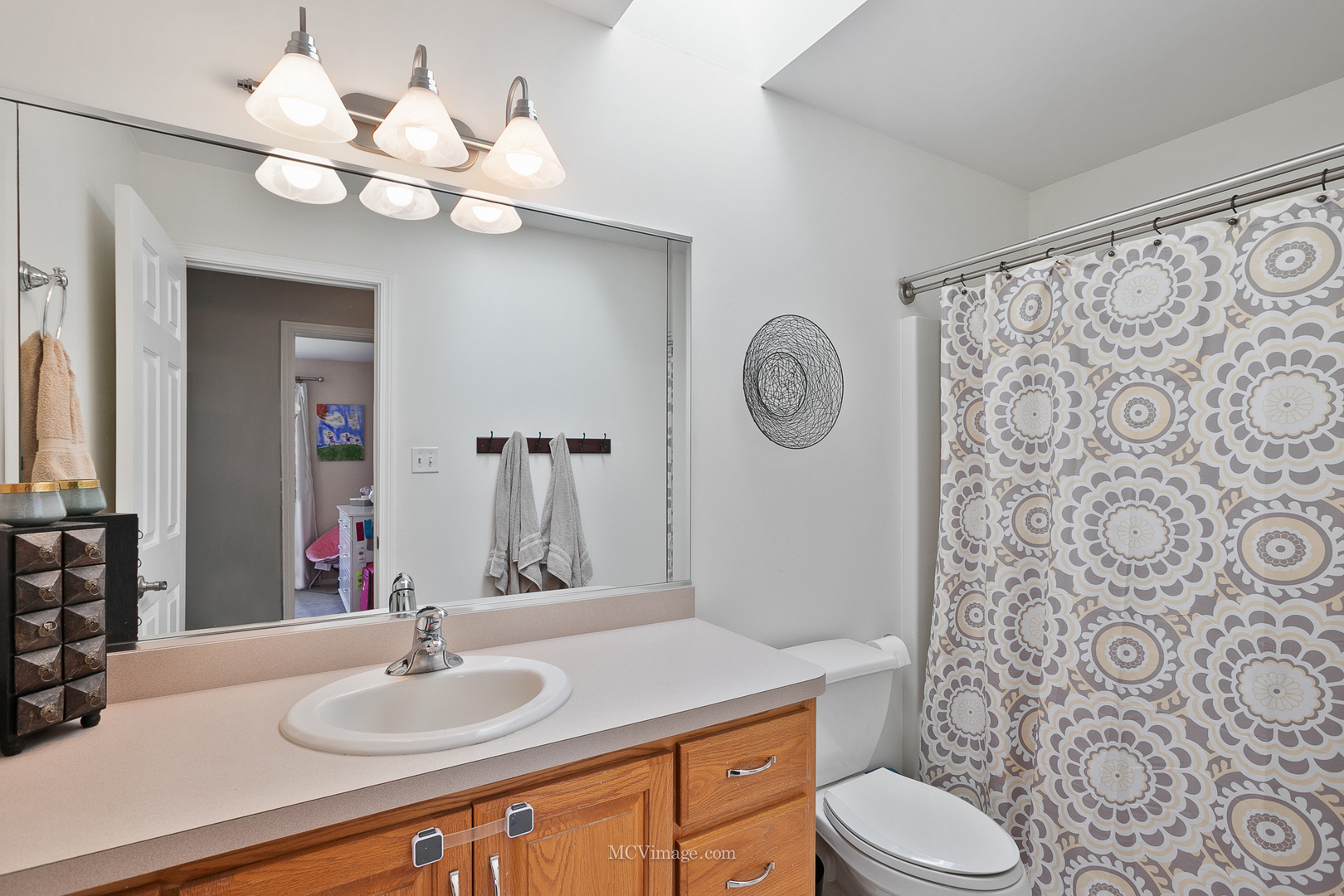 40 Zurich Court Crete, IL 60417 - Photo 20 of 40 a bathroom with a sink a toilet and a mirror