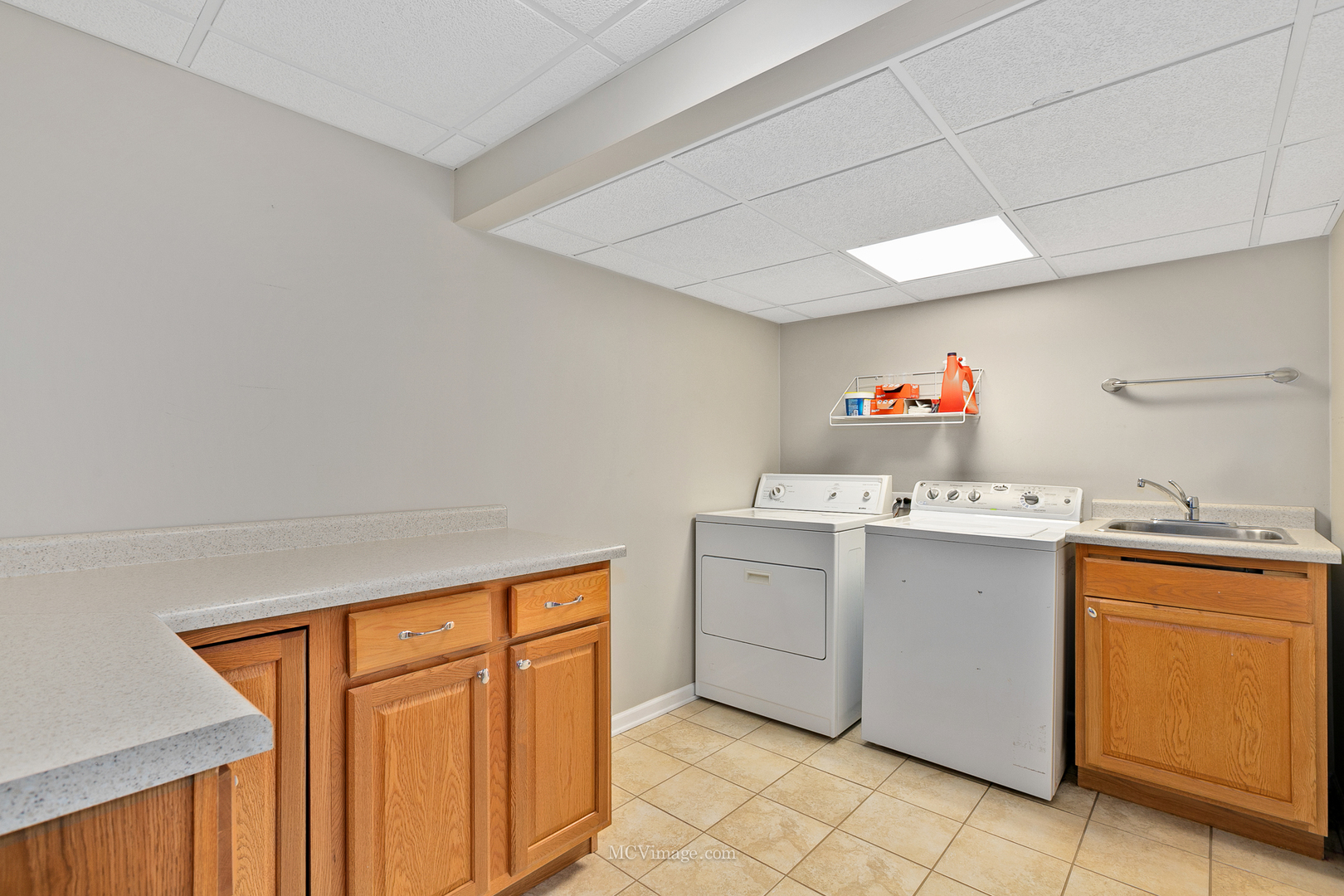 40 Zurich Court Crete, IL 60417 - Photo 28 of 40 a utility room with cabinets washer and dryer