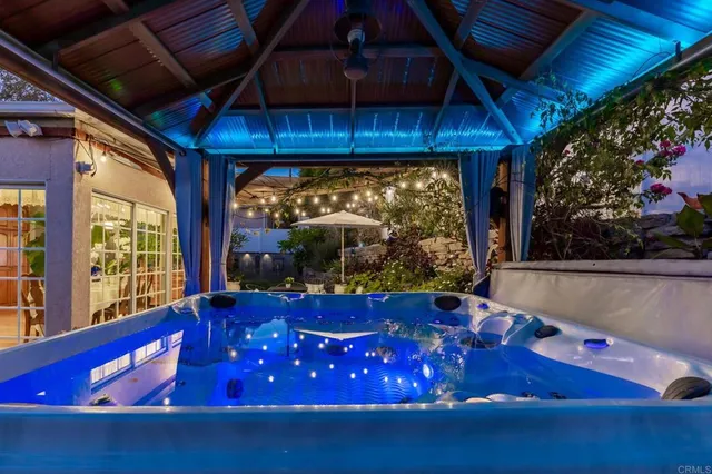 a view of a chairs and table in a patio
