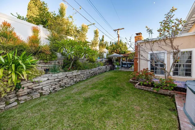 a patio with a patio table and chairs under an umbrella