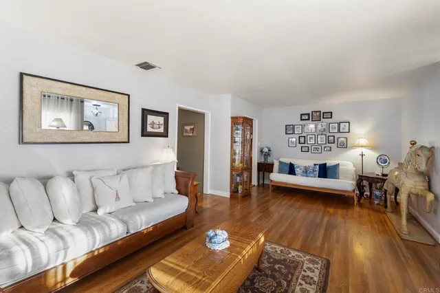 a living room with furniture a lamp and a fireplace
