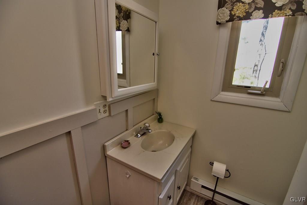 202 McKay Road Henryville, PA 18332 - Photo 29 of 41 View of the decorative wainscoting, vanity & mirro