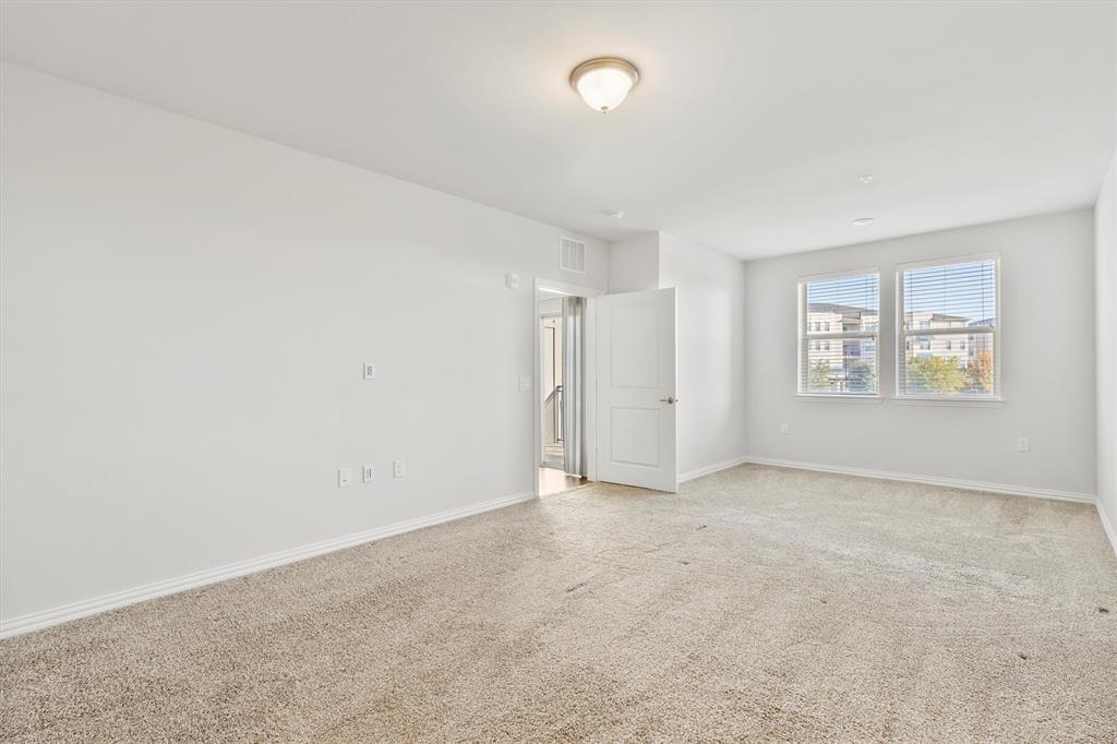 651 Watters Road, Unit 7202 Allen, TX 75013 - Photo 15 of 33 an empty room with windows