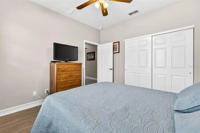 a bed room with a bed and a dresser