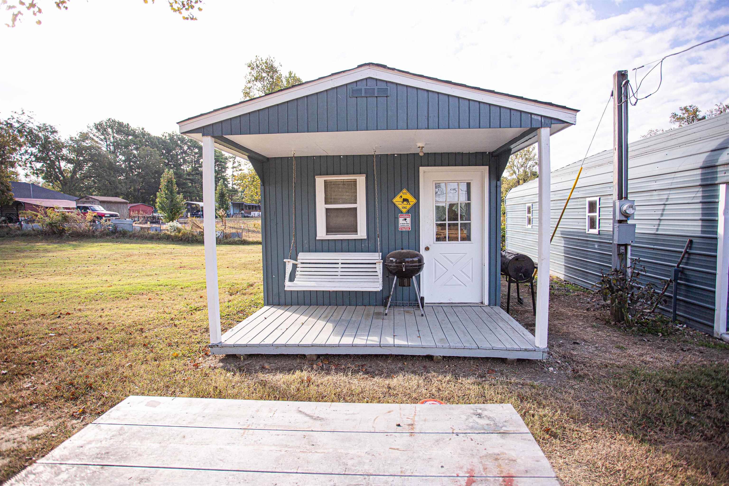 4100 Highway 209 Ripley, TN 38063 - Photo 27 of 36 a front view of a house with swimming pool outdoor seating